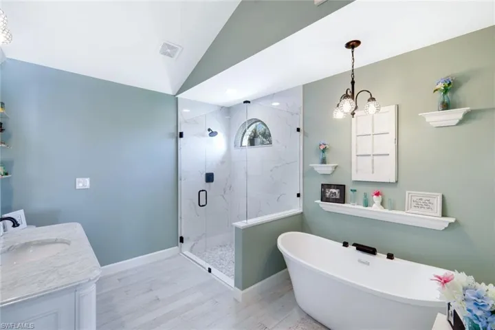 Primary bathroom with separate tub and shower