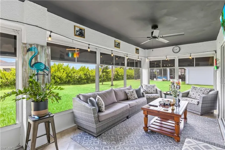 Sunroom / solarium featuring an outdoor living space and ceiling fan