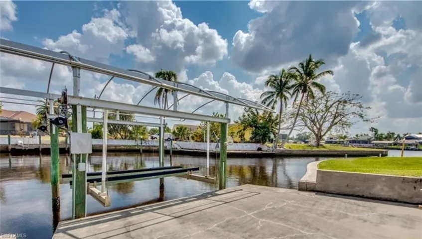 Dock area featuring a water view