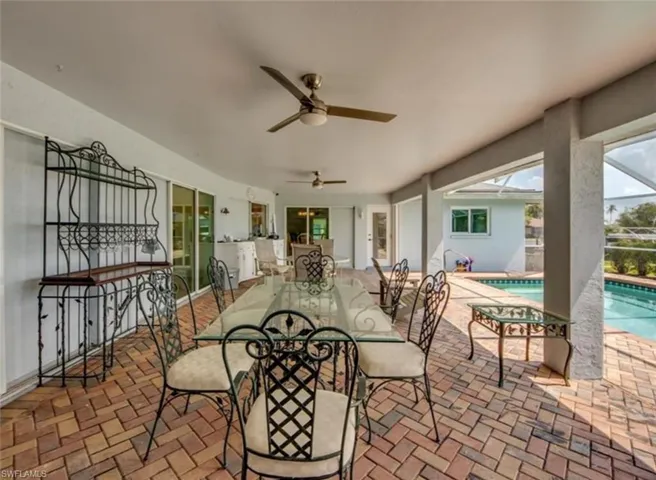 View of patio featuring ceiling fan