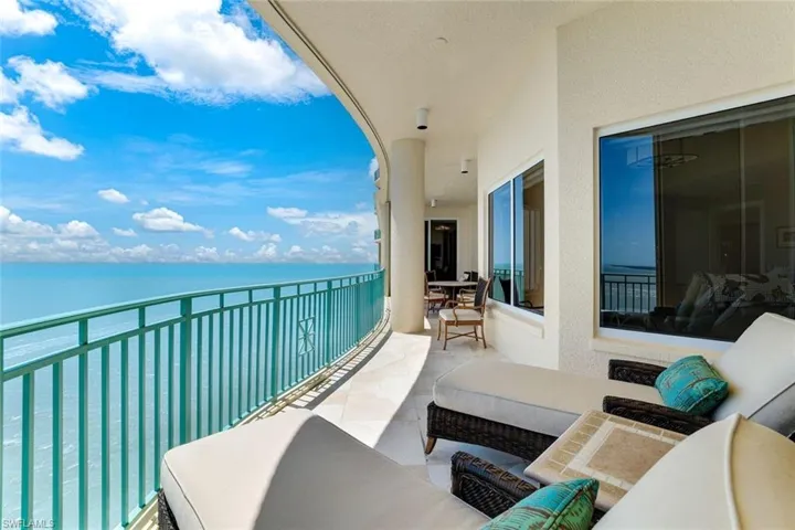 Balcony featuring a water view and an outdoor hangout area