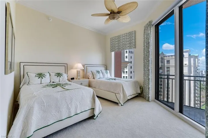 Carpeted bedroom with ornamental molding, access to exterior, and a ceiling fan