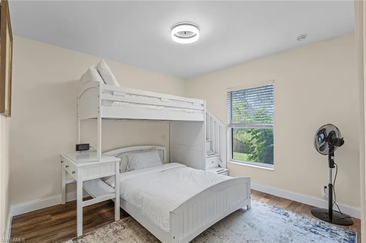 Bedroom featuring wood-type flooring