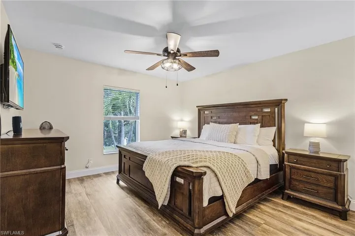 Bedroom featuring light wood-type flooring and ceiling fan