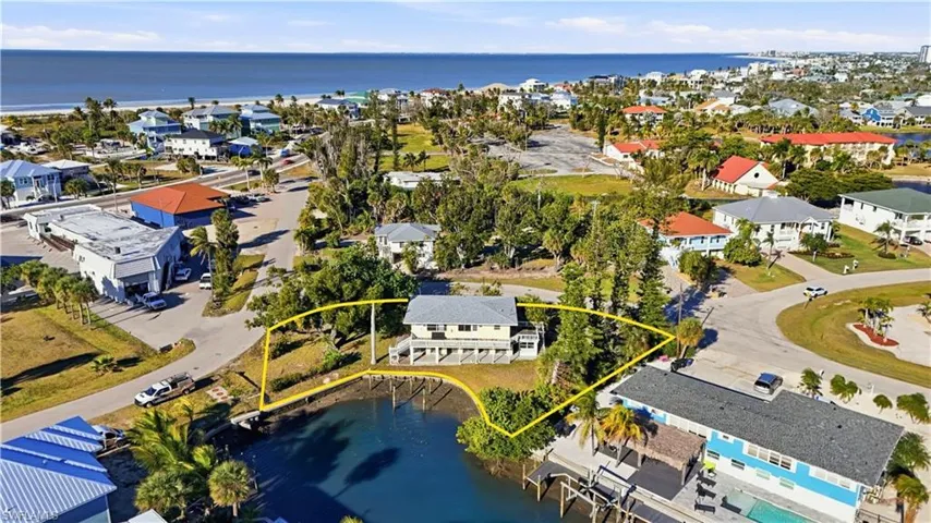 Aerial view of residential area with a large body of water - Virtually Edited Image