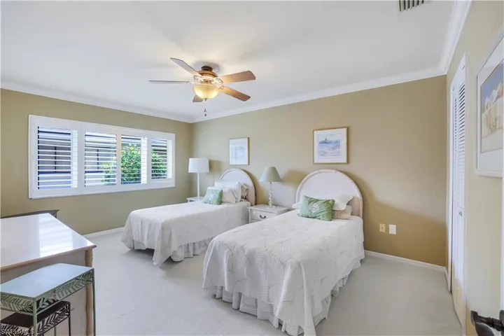 Super Size Guest Bedroom Shown With 2 Twin Beds, Large Walk In Closet, Low Nap Carpet