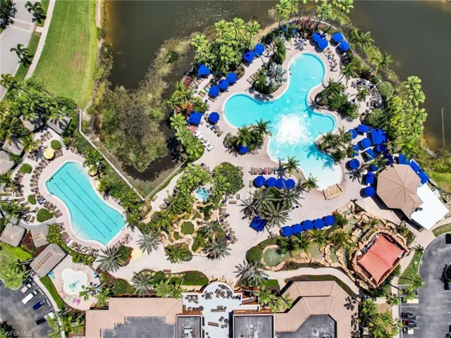 Bird's eye view of a pool area and a large body of water