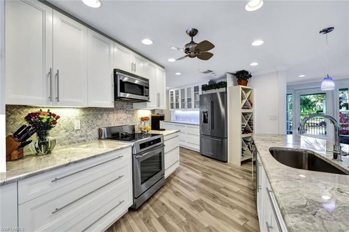 The kitchen is the center of the home and has marble countertops