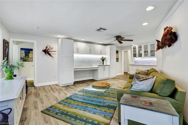 Behind the kitchen is a living room/hobby area with built ins for extra storage