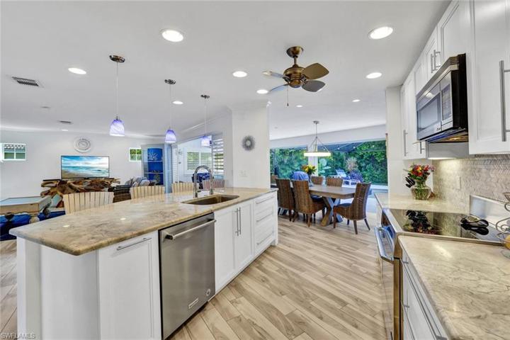 The kitchen is the center of the home and has marble countertops