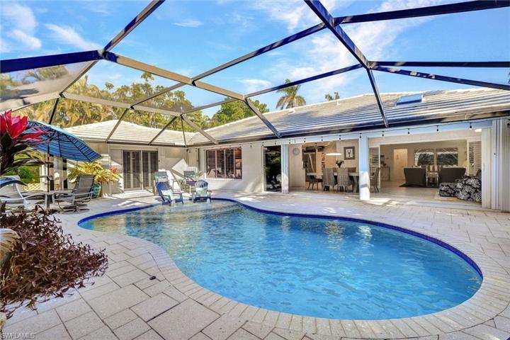 The back of the house opens up to the pool