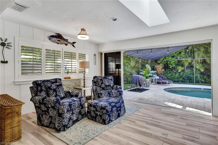 Sunroom opens up to the screened in pool