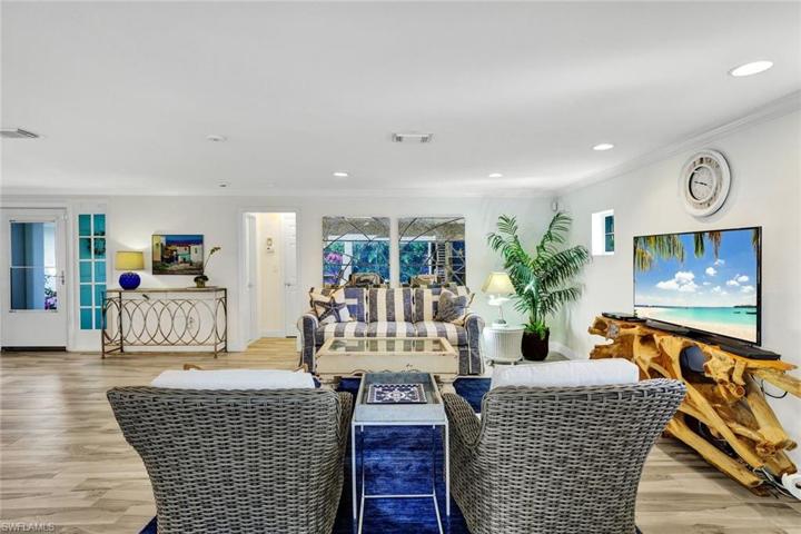 Family room facing the front door and hall to guest suite