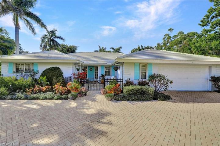 The quintessential beach bungalow with two car garage
