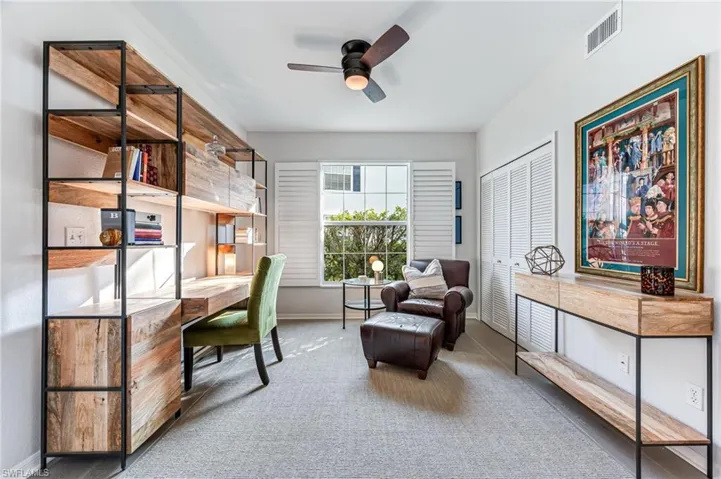 Office area featuring carpet flooring and ceiling fan