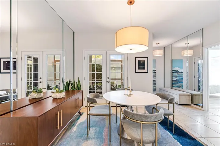 Tiled dining space with french doors