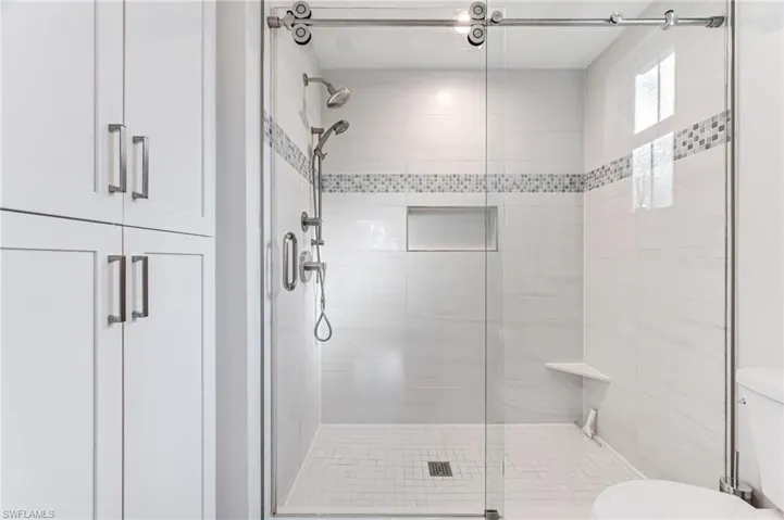Bathroom with walk in shower and toilet