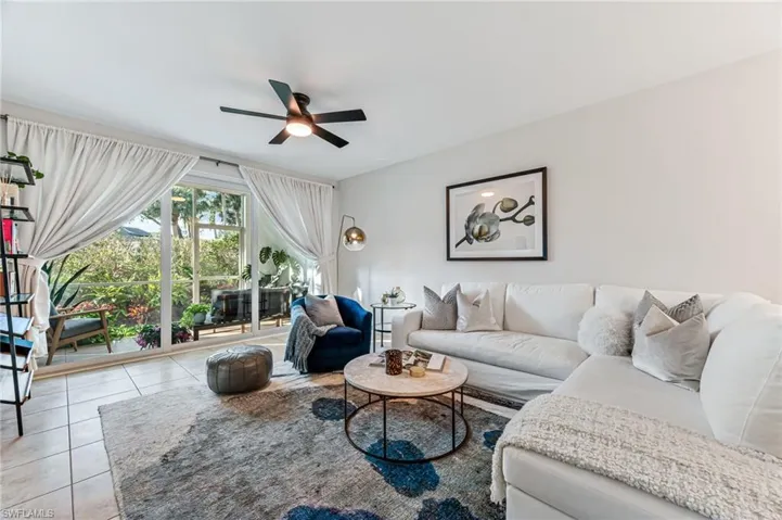 Tiled living room with ceiling fan