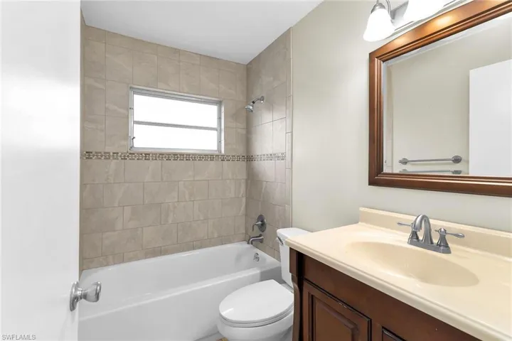 Bathroom featuring vanity and tub / shower combination