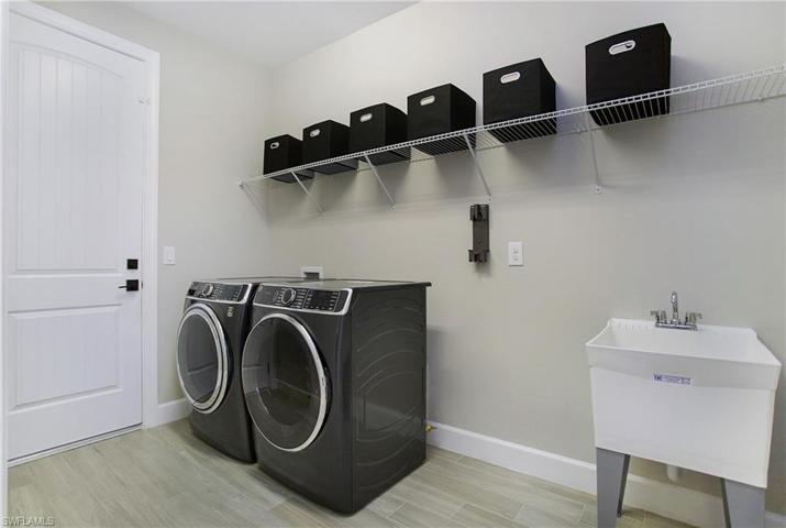 Laundry Sink is such a plus..Washer & Dryer included