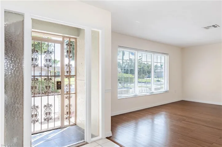 Doorway to outside featuring light wood-type flooring