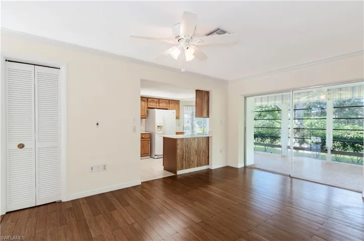 Unfurnished living room featuring ceiling fan and light hardwood / wood-style floors