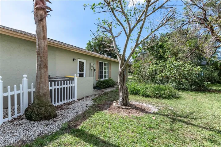 View of property exterior featuring a yard