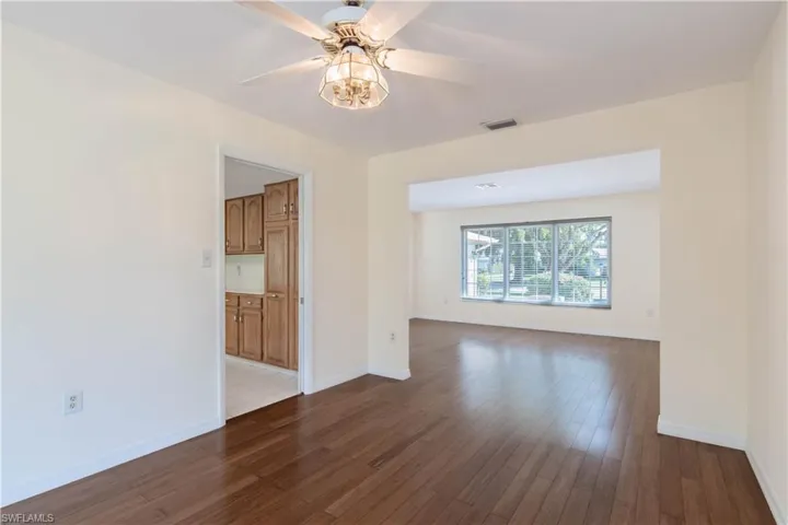 Spare room featuring ceiling fan and light wood-type flooring