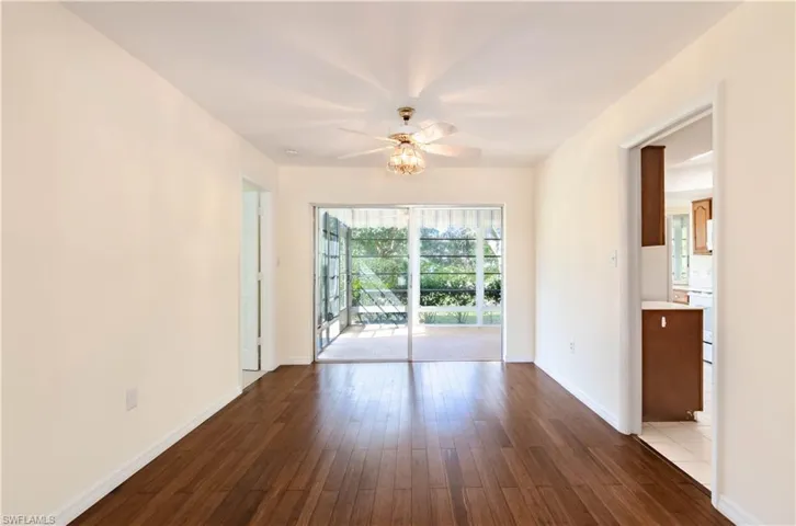 Unfurnished room featuring ceiling fan and wood-type flooring