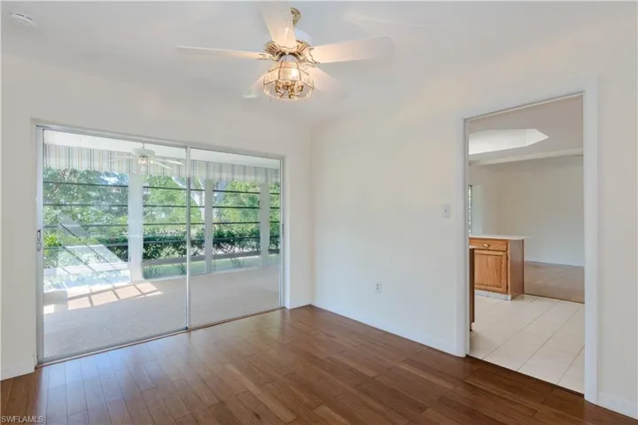 Unfurnished room featuring ceiling fan and light hardwood / wood-style flooring