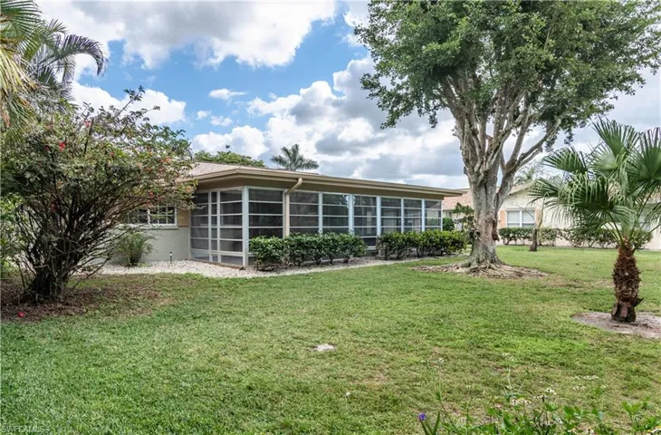 View of yard with a sunroom