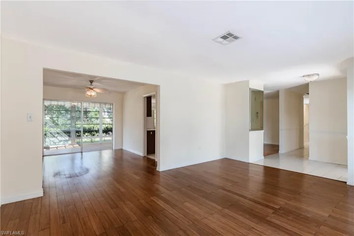 Spare room featuring ceiling fan and light wood-type flooring