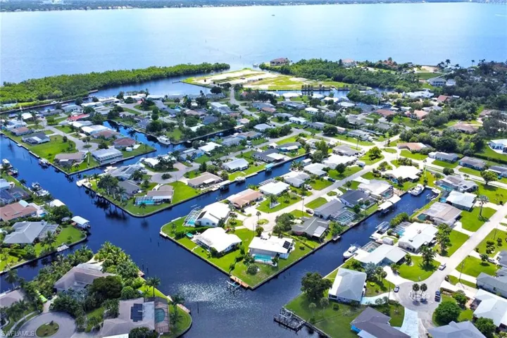 Aerial perspective of suburban area with a large body of water