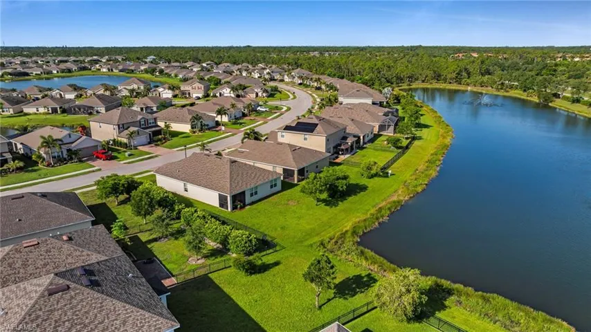Expansive residential community featuring a large lake and numerous single-family homes