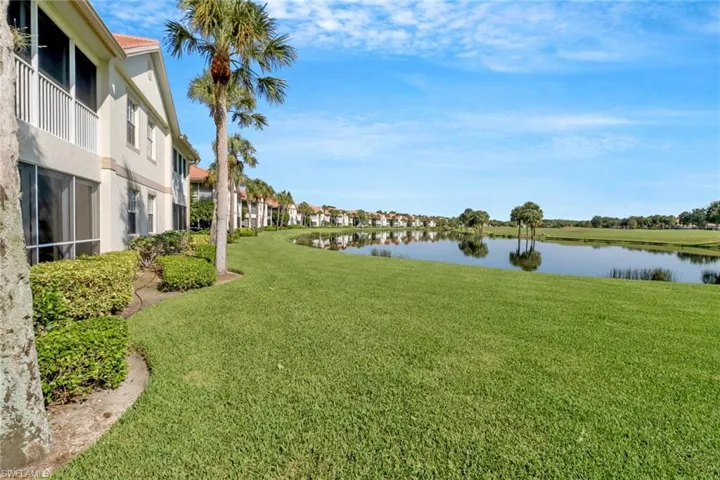 View of yard with a water view