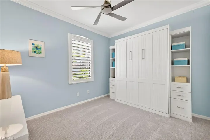 bedroom featuring crown molding, ceiling fan
