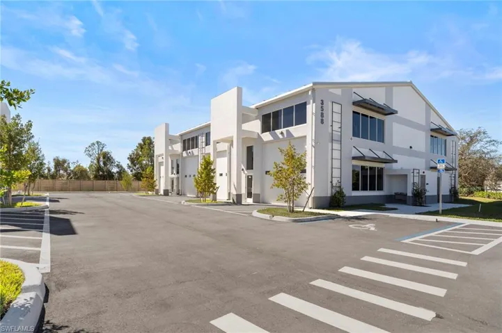 View of asphalt street featuring curbs