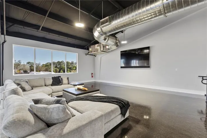 Living area featuring baseboards