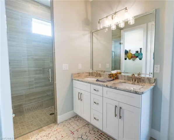 Bathroom featuring vanity and walk in shower