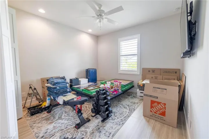 Game room featuring ceiling fan and light wood-type flooring