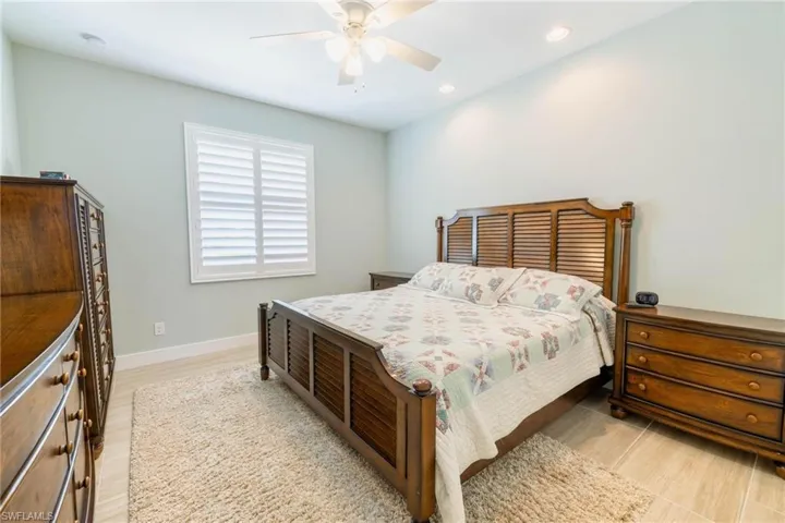 Bedroom featuring light hardwood / wood-style flooring and ceiling fan