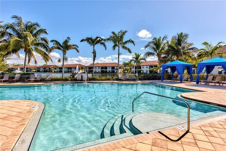 Resort style heated pool with cabanas overlooking the lake