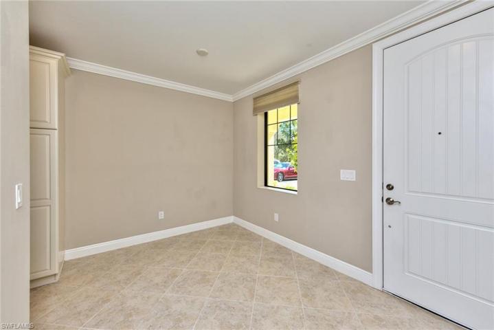 Front door entry + eat in kitchen with window