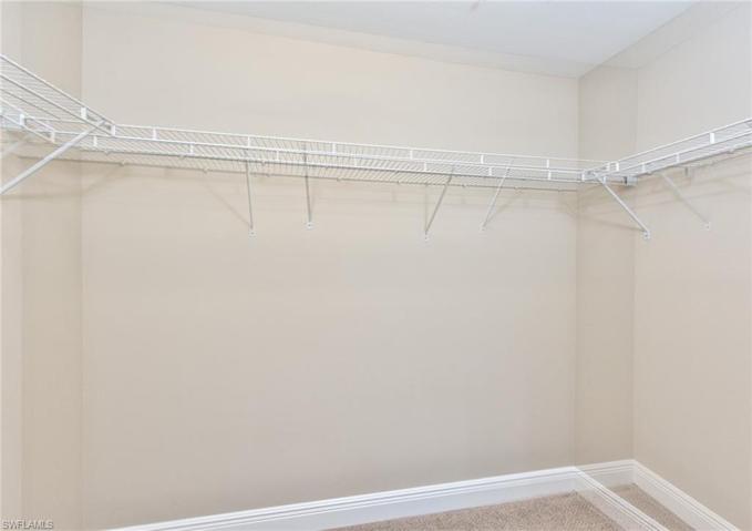 Large walk in closet with brand new carpet