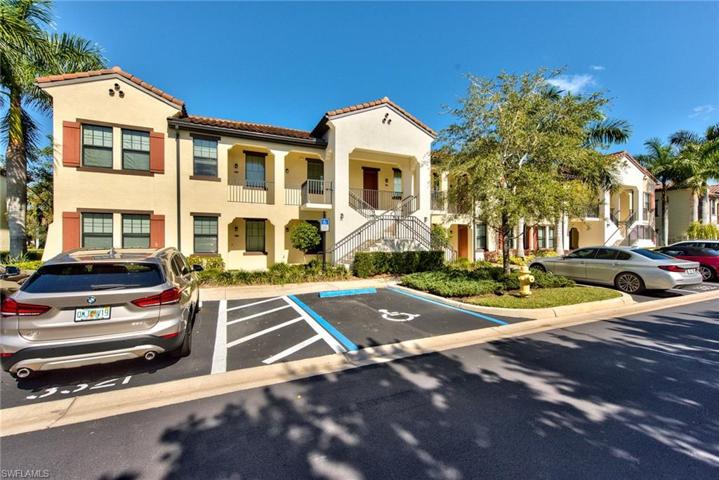 Exterior building with 1 parking space #3312 located right in front of the unit (where silver car is to the right)