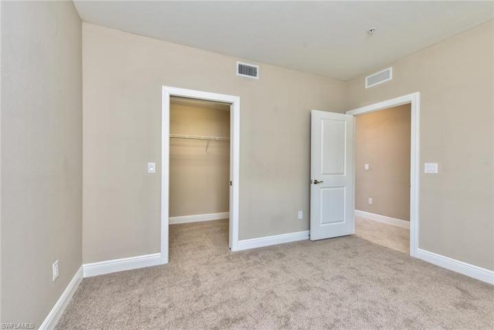 Guest bedroom with large walk-in closet and brand new carpet