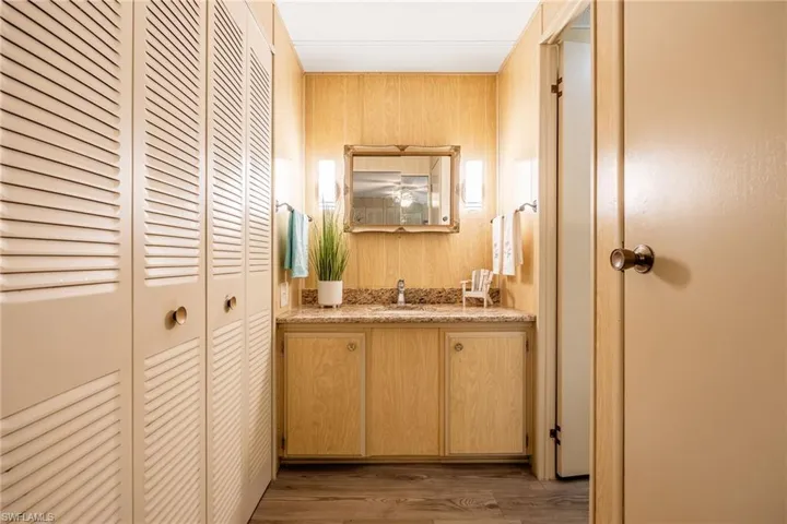 Closet on left and linen closet on right. Sink and prep area are outside the private shower and toilet.