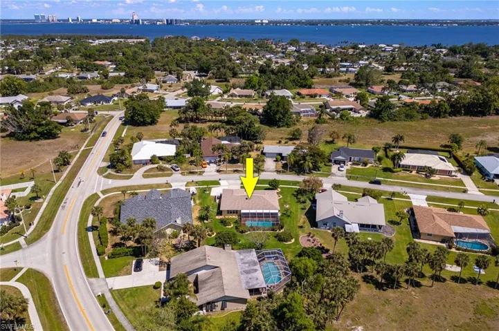 Drone / aerial view featuring a residential view and a water view