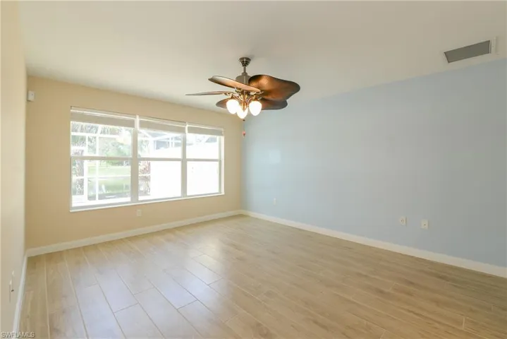 Empty room featuring light hardwood / wood-style floors and ceiling fan