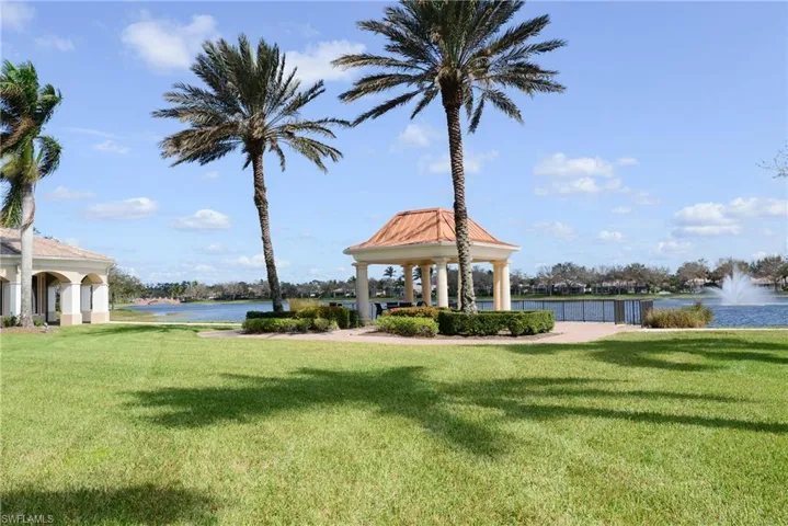 View of property's community featuring a gazebo, a yard, and a water view